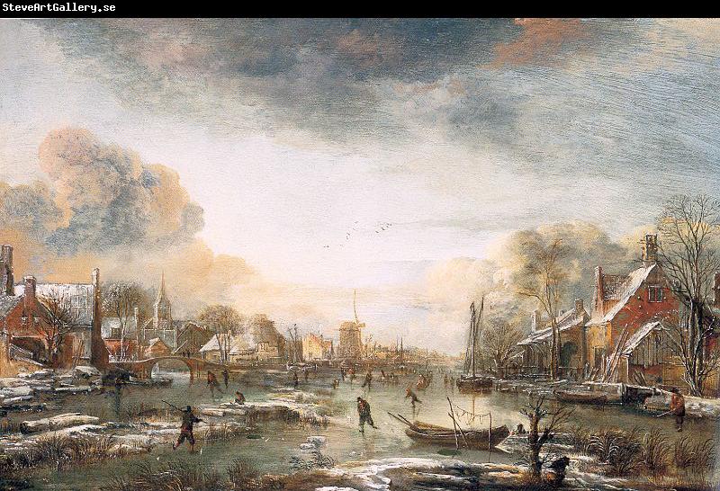 Aert van der Neer A Frozen River by a Town at Evening